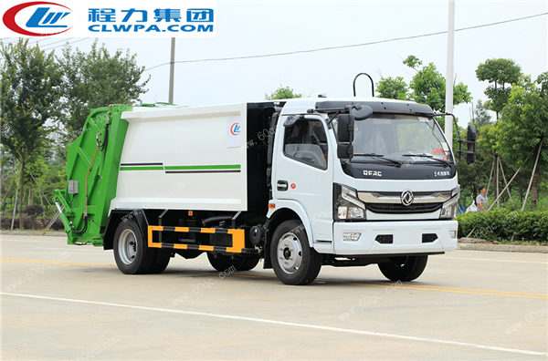 國六東風(fēng)凱普特壓縮垃圾車交付煙臺某鄉(xiāng)村居委會